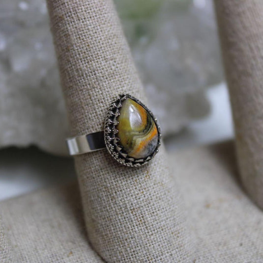 Bumblebee Jasper Sterling Silver Ring on a display stand.