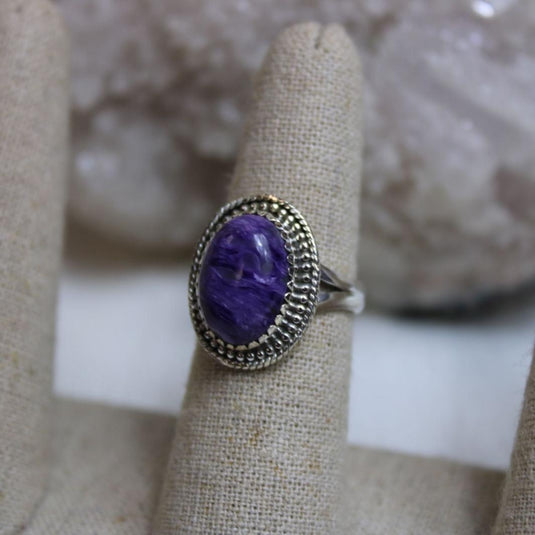 The captivating purple and lavender swirls of the Charoite gemstone shine in this elegant silver ring.