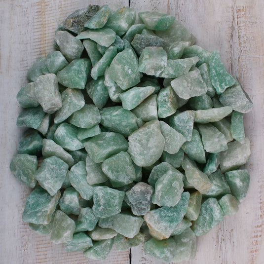 A pile of raw green Aventurine stones available at Keshet Crystals Shop