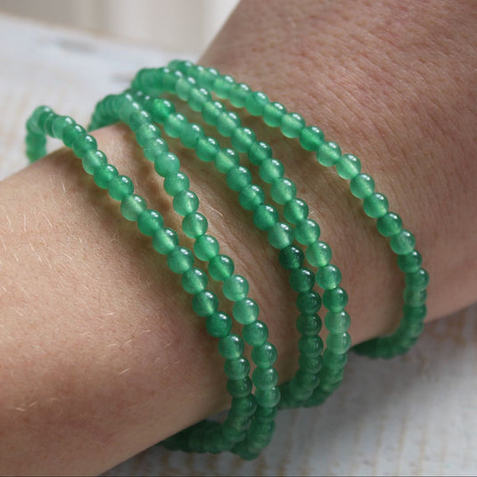 Green Aventurine Crystal 4mm Bead Bracelets Stacked and Modelled on a Wrist