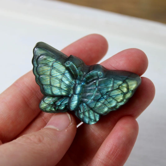 A labradorite butterfly carving, capturing the stone's mystical energy and iridescent beauty.