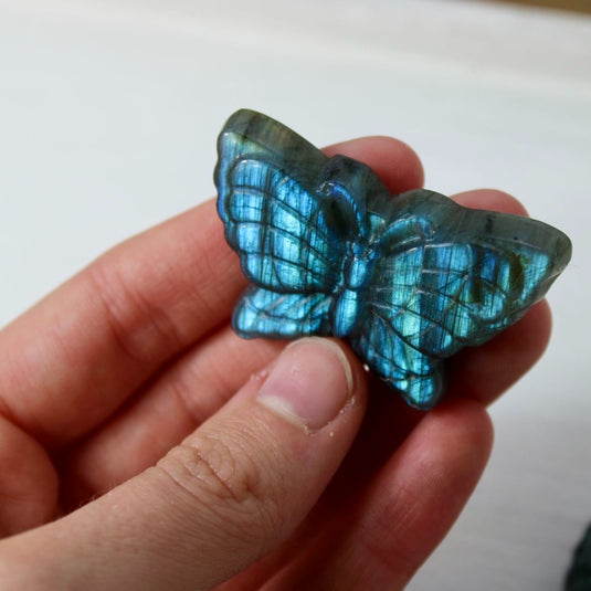 A labradorite butterfly carving, capturing the stone's mystical energy and iridescent beauty.