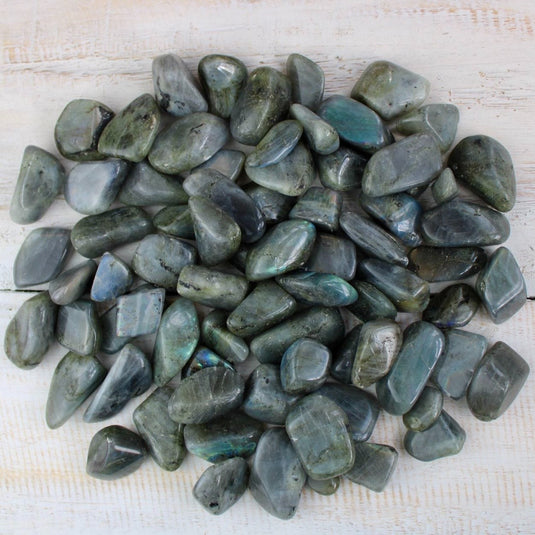 A collection of Labradorite tumbled stones, in the shop Keshet Crystals based in Petersfield, England.