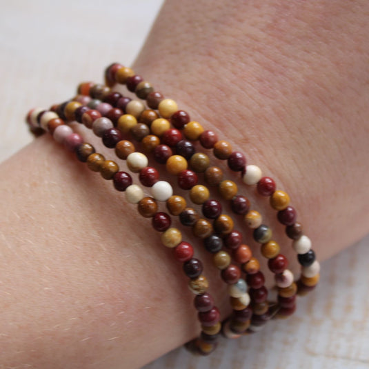 Mookaite Jasper Crystal Bracelets stacked on a wrist