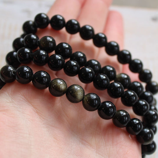 Golden Sheen Obsidian Bead Bracelet Modelled on Hand