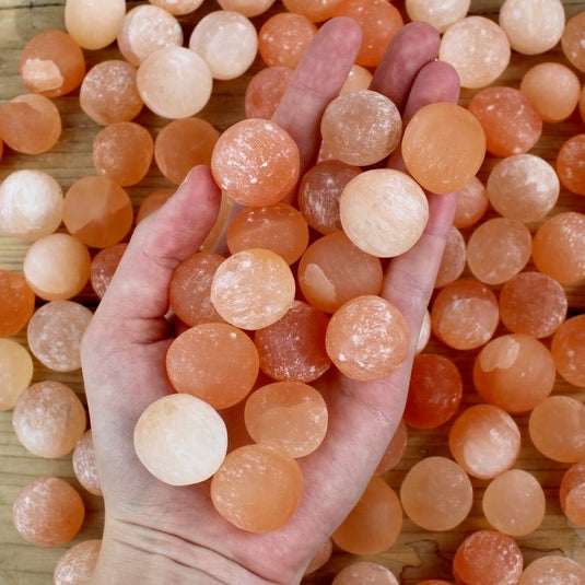 Peach Selenite In Hand - Tumblestones - Keshet Crystals in Petersfield