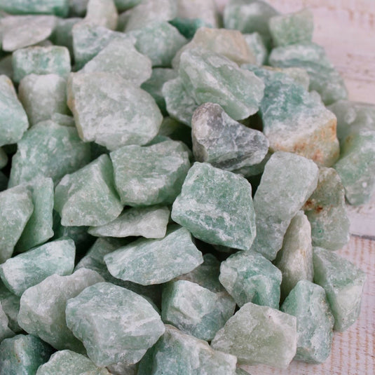 A close-up of raw green Aventurine crystals