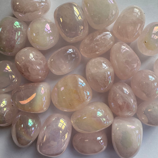 Aura Rose Quartz Tumblestones on a White Background