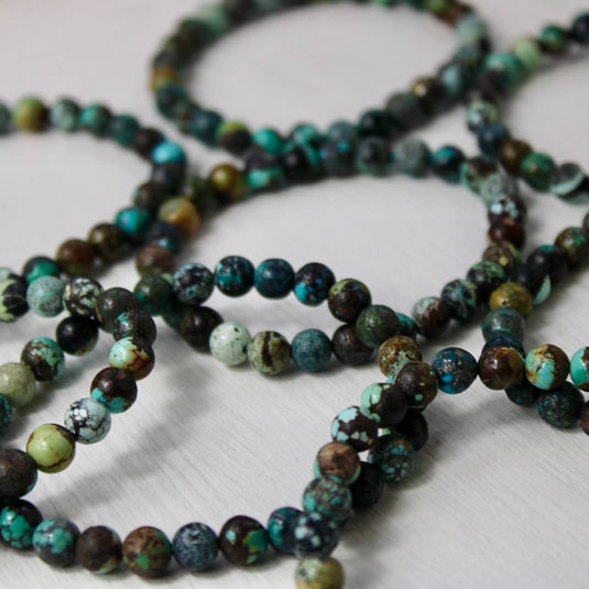 A collection of Chinese Turquoise round bead bracelets.