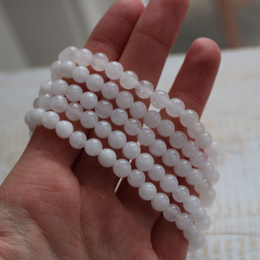 White Jade Bracelets Stacked on Hand